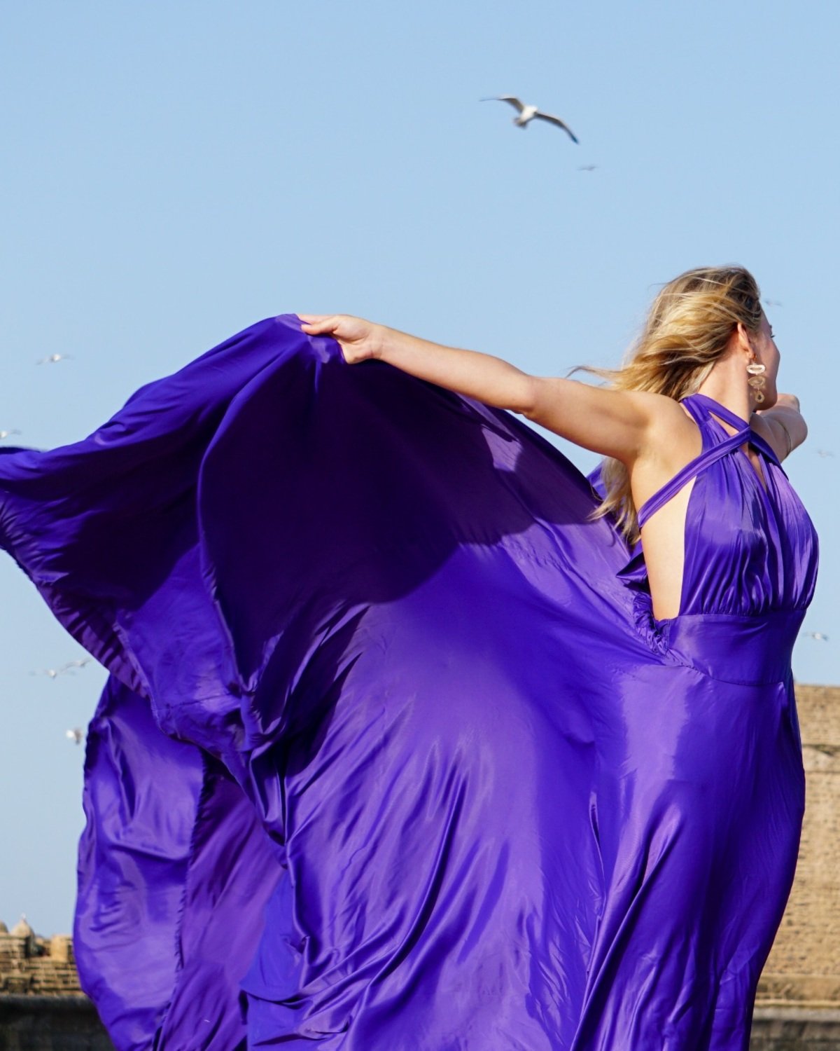 Model wearing the purple Kyoto Flying Dress at Essaouira port